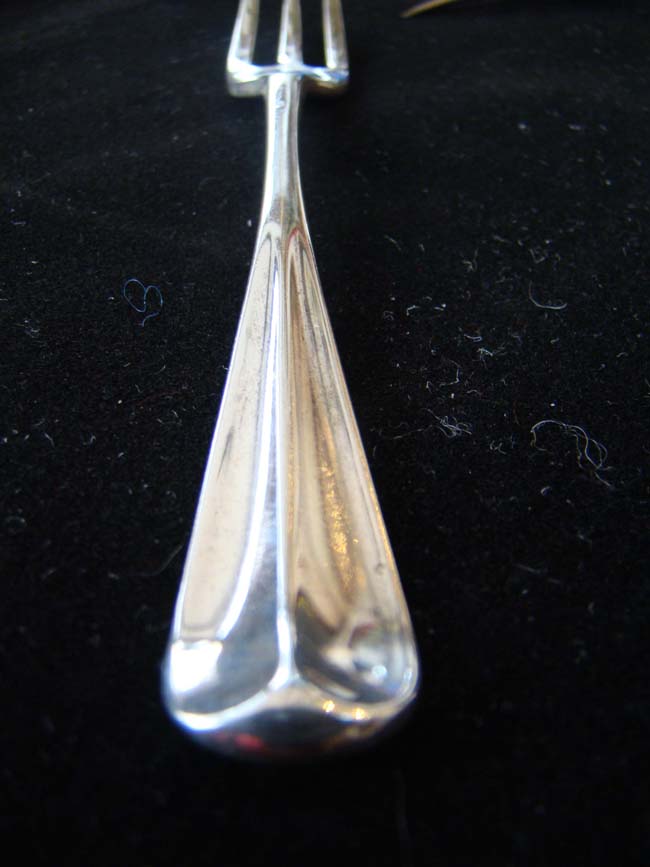 A fine and RARE set of eleven IRISH three-pronged sterling silver dessert forks by Michael Hewitson of Dublin circa 1725-1750 — image 5